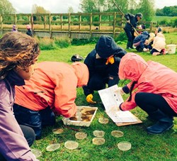 Children examining river samples at Hudnall Park