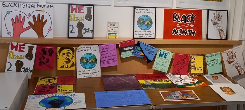 Colourful display of artwork created by young people for Black History Month 2022