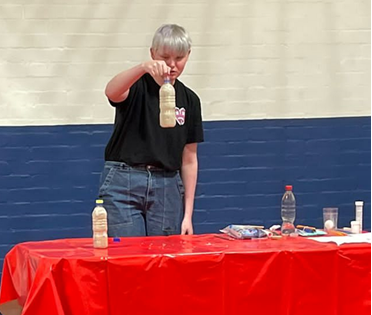 Young person conducting a science experiment