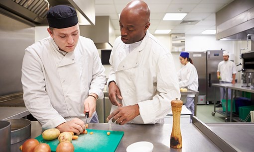 A young person working on a kitchen apprenticeship