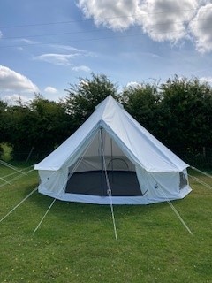 Tent set up on the grass at Hudnall Park.