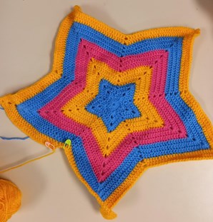 Crocheted Pride flag created by young people.