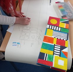 A young woman drawing geometric designs